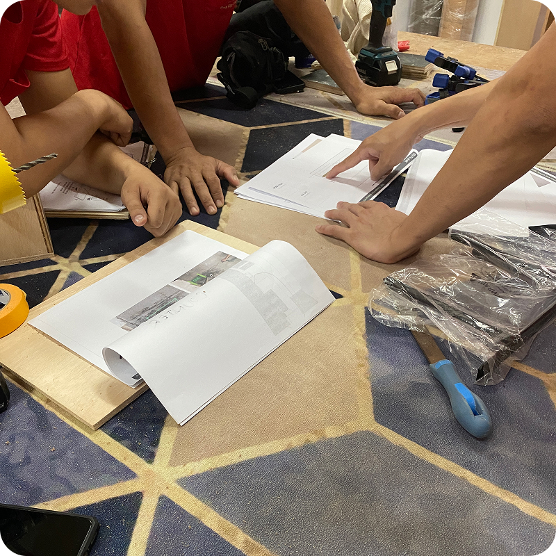 Explaining drawings to workers